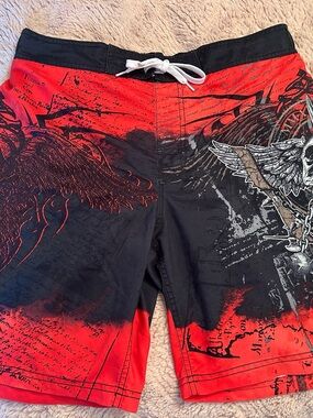 Men's Red and Black Graphic Swim Board Shorts with Winged Skull Motif